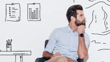 Man sitting in chair, thinking, with doodle background of charts and mountains.