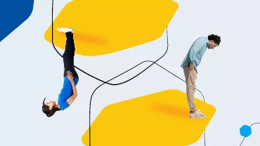 Two people standing and upside down against abstract yellow shapes.